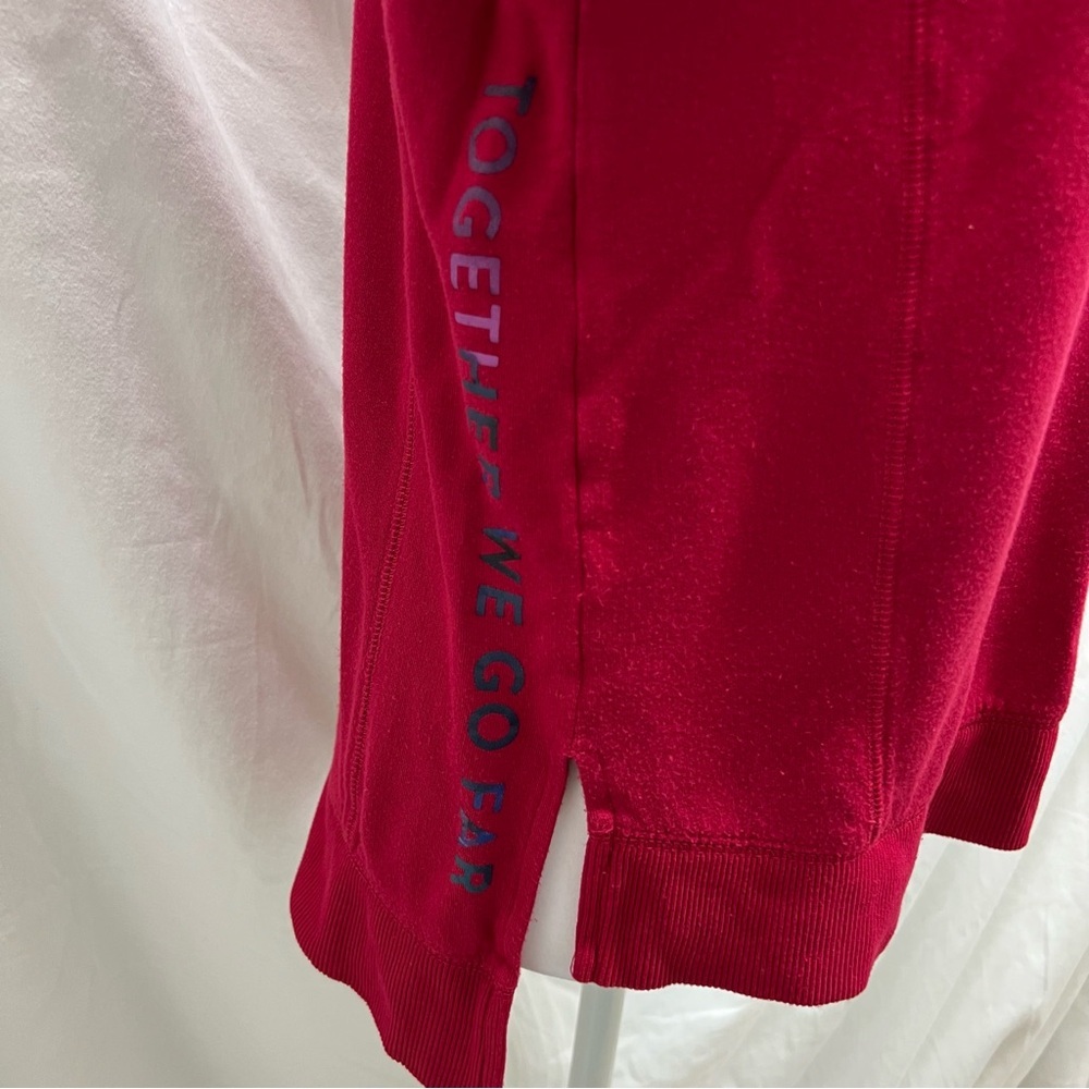 Peloton cranberry colored lightweight sweatshirt with multi-color brand name. - Picture 3 of 8